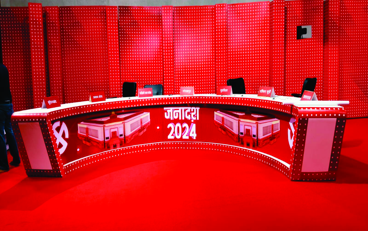 Mega event janadesh Red color studio with a table and three chair, branding in Lucknow